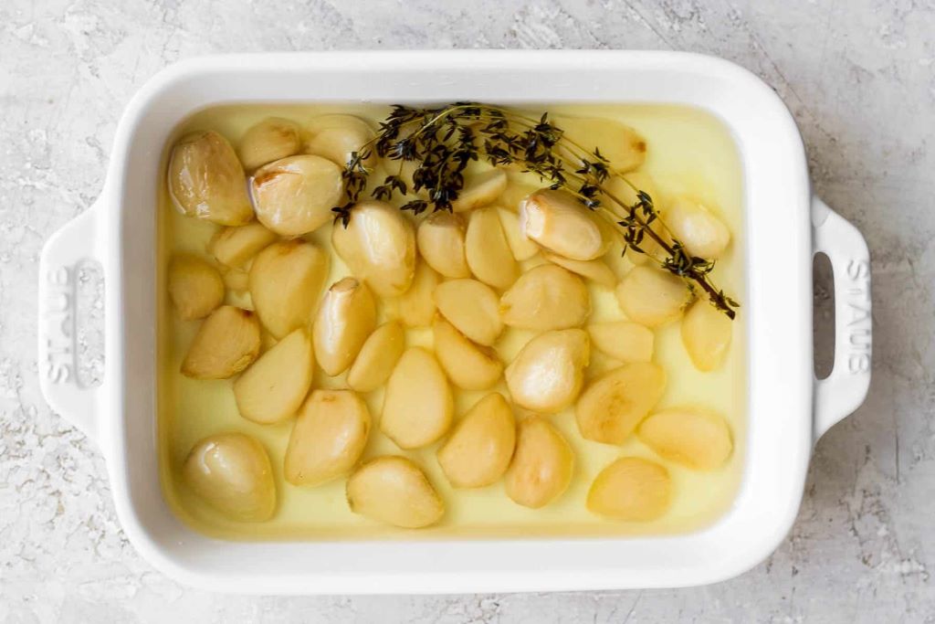 What are the side effects of garlic confit?