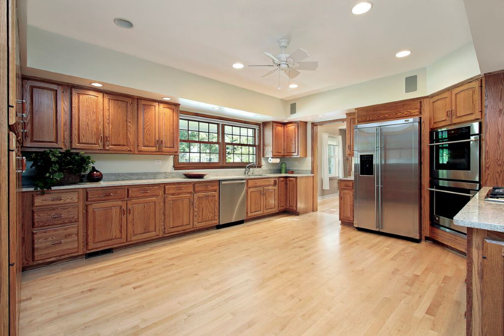 What is the most efficient way to clean kitchen floors?