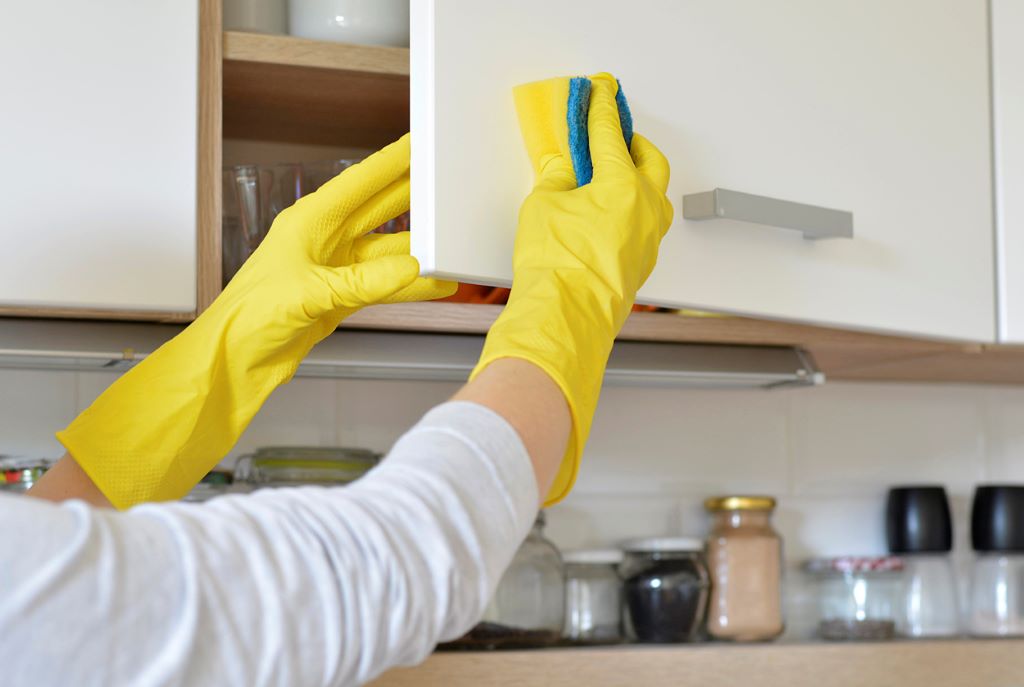 How do you remove old sticky grease from cabinets?