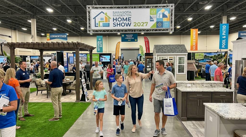A family attending the Sarasota Bradenton Home Show 2027 with home renovation displays in the background